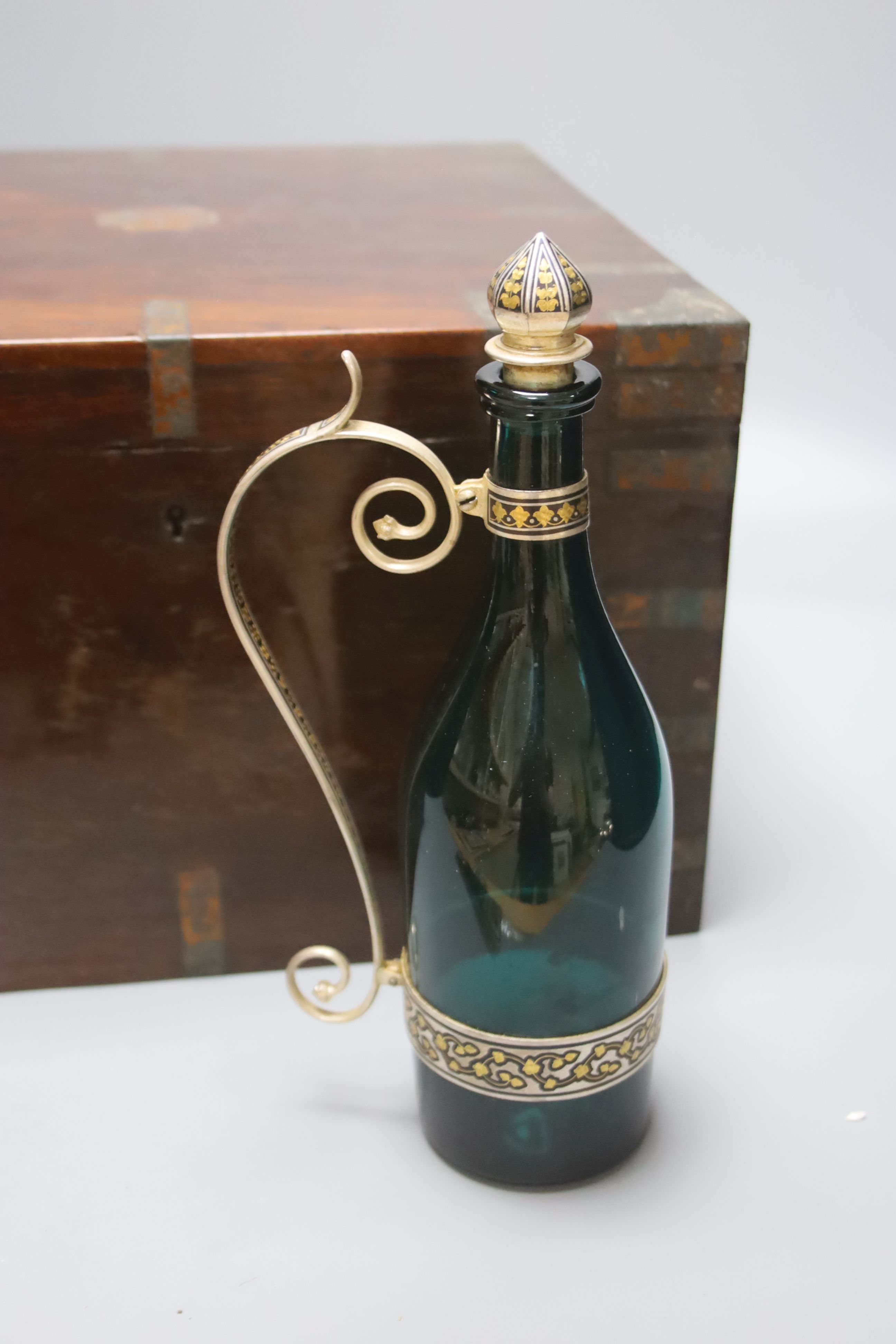 An early 20th century Indian niello and gilt metal liqueur set, with six goblets, pair of decanters and in a hardwood box